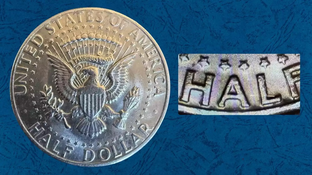 1974 Kennedy Half Dollar reverse DDR doubled die showing three-dimensional hub doubling on UNITED STATES OF AMERICA or HALF DOLLAR reverse lettering